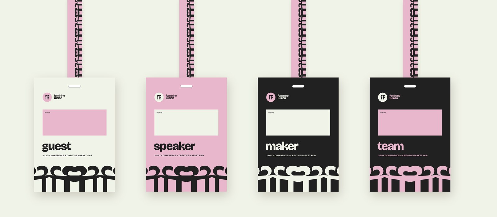 Four badges on their lanyards: guest, speaker, maker, team