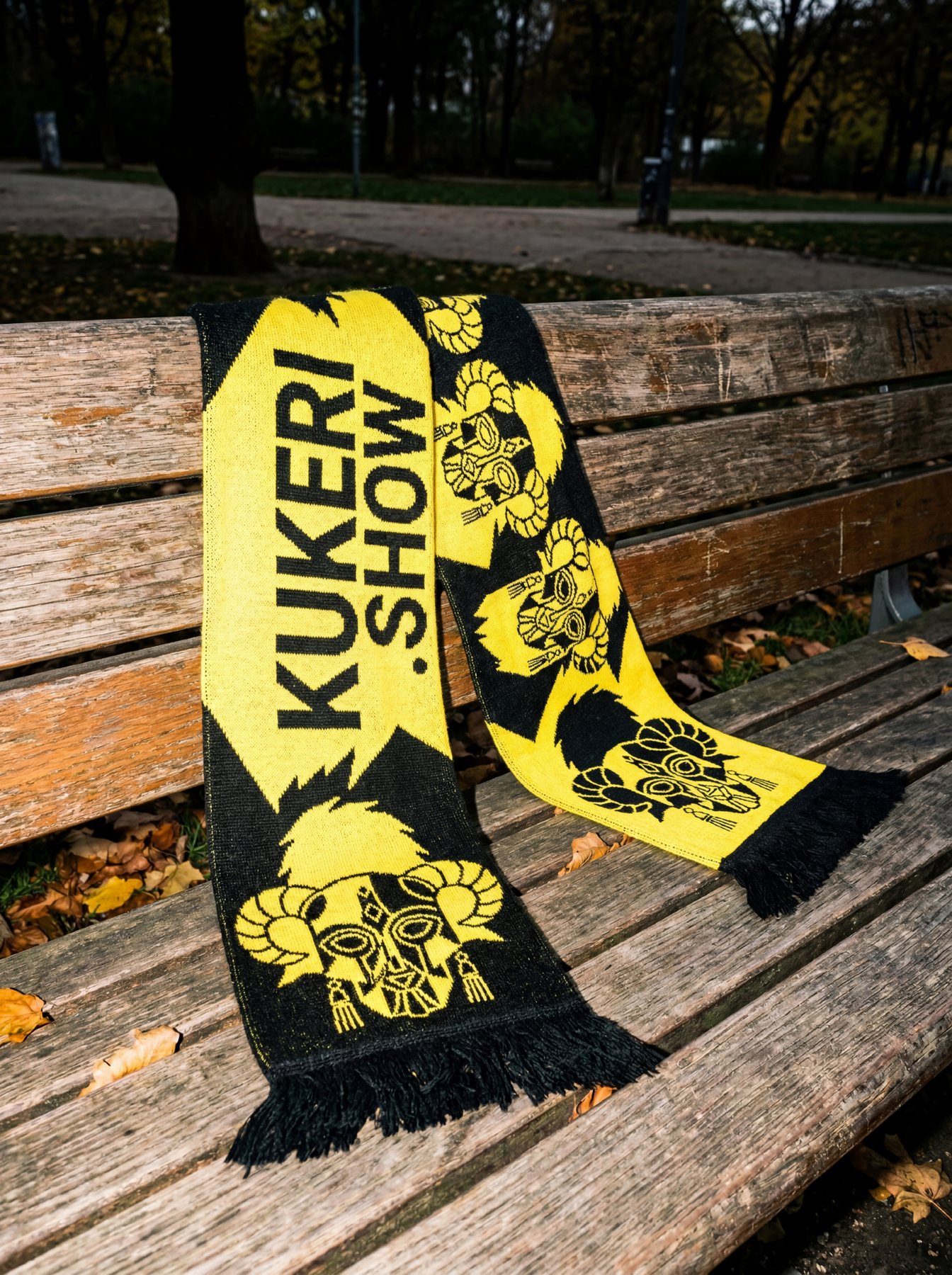 The yellow and black Kukeri scarf on a bench