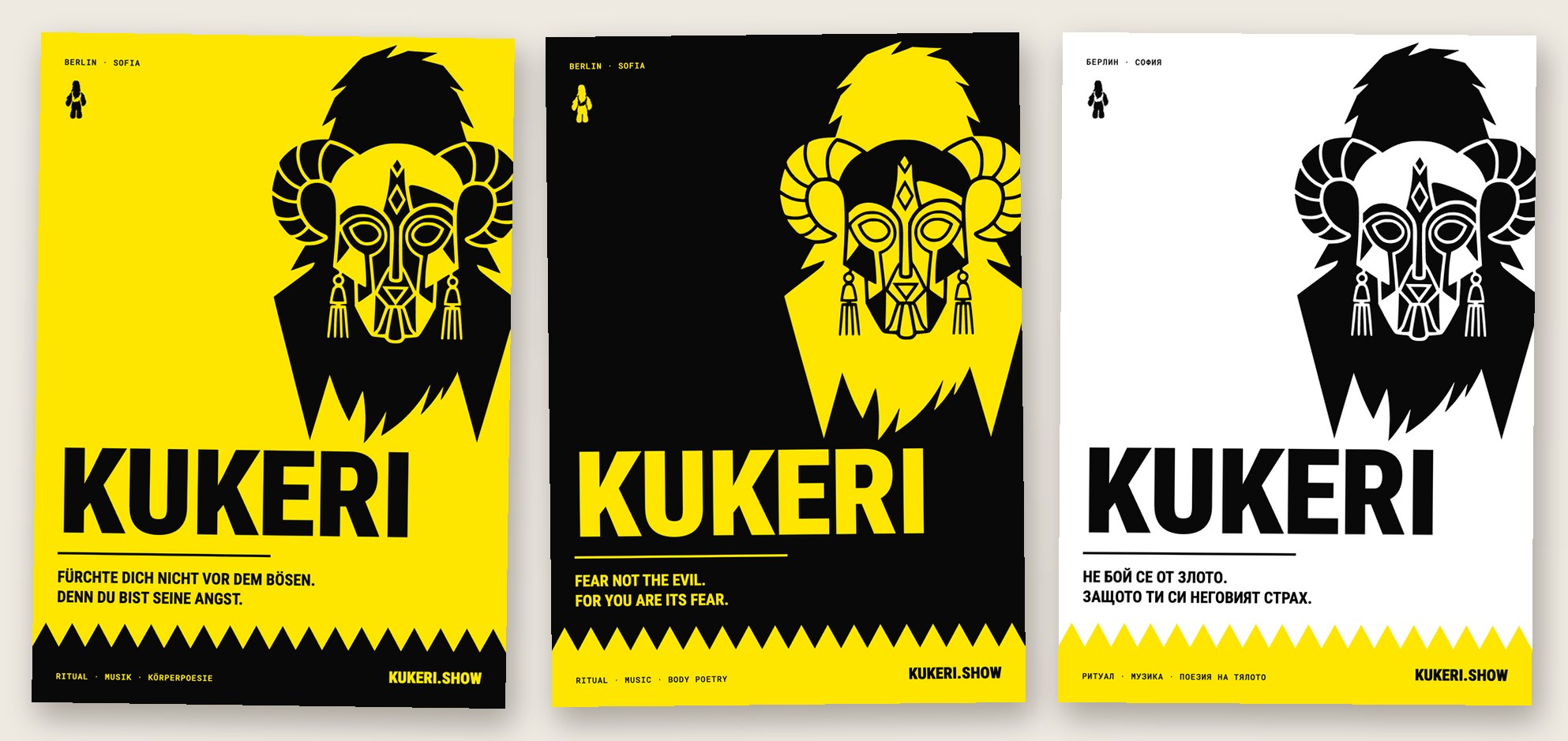 Three posters flat on the desk: German on yellow, English on black, Bulgarian on white