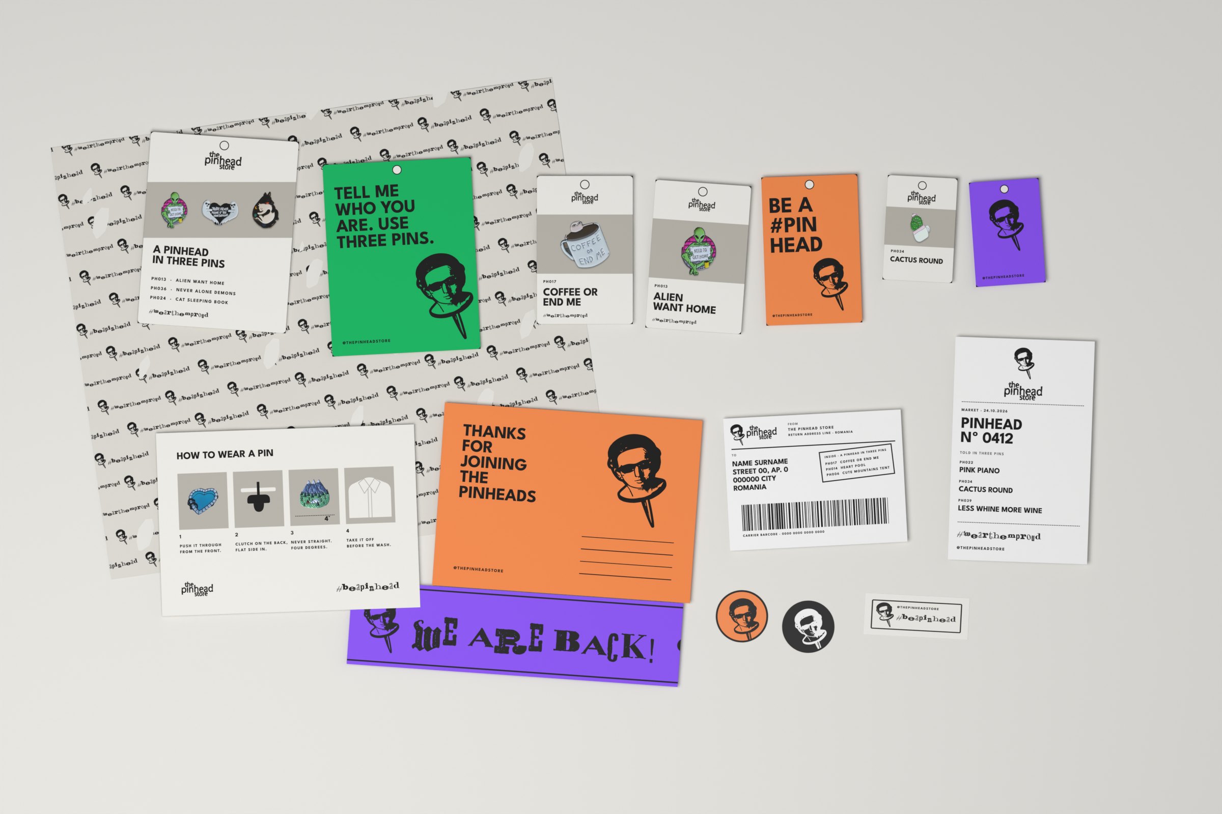 Everything that goes in the parcel, flat: tissue, backing cards in three sizes, the thank-you card, how to wear a pin, seals, tape and the label